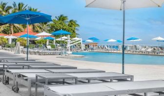 Sun loungers and umbrellas at Ramada Plaza Marco Polo Beach Resort.