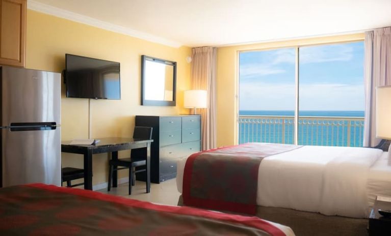 Romantic king room with TV at Ramada Plaza Marco Polo Beach Resort.