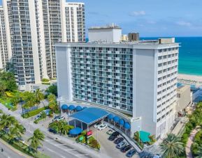 Hotel exterior and city view at Ramada Plaza Marco Polo Beach Resort.