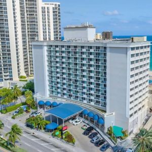 Hotel exterior and city view at Ramada Plaza Marco Polo Beach Resort.