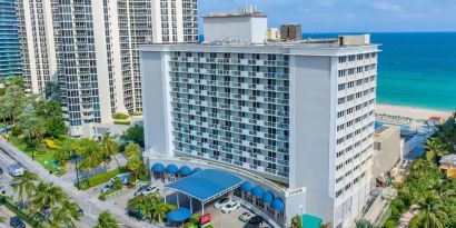 Hotel exterior and city view at Ramada Plaza Marco Polo Beach Resort.