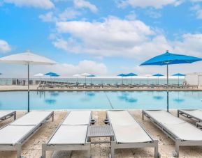 Relaxing sun loungers at Ramada Plaza Marco Polo Beach Resort.