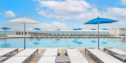 Relaxing sun loungers at Ramada Plaza Marco Polo Beach Resort.