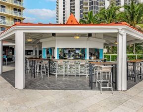 Hotel bar and coworking space at Ramada Plaza Marco Polo Beach Resort.