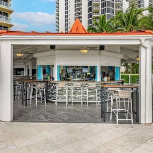 Hotel bar and coworking space at Ramada Plaza Marco Polo Beach Resort.