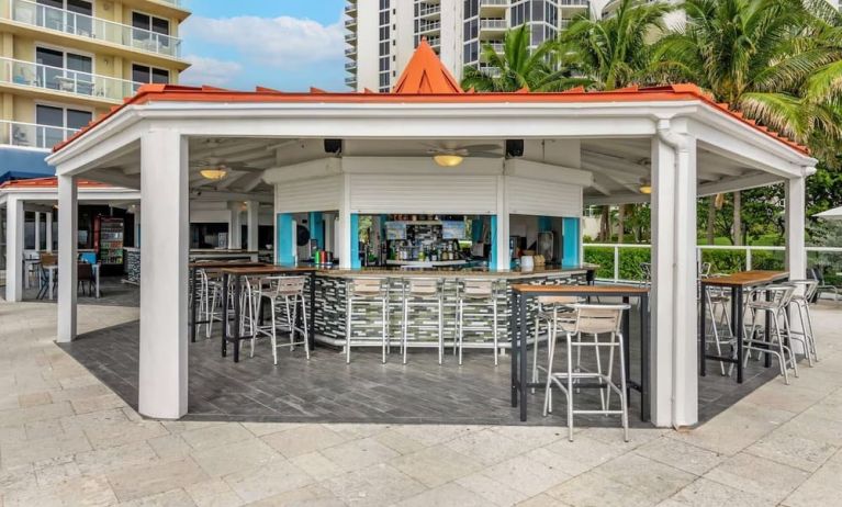 Hotel bar and coworking space at Ramada Plaza Marco Polo Beach Resort.