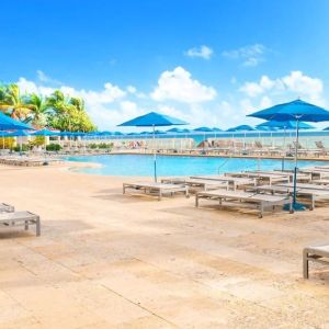 Relaxing pool area at Ramada Plaza Marco Polo Beach Resort.