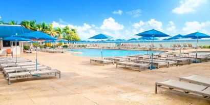 Relaxing pool area at Ramada Plaza Marco Polo Beach Resort.