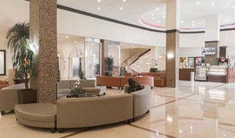 Lobby seating at Ramada Plaza Marco Polo Beach Resort.