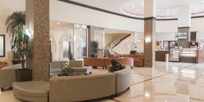 Lobby seating at Ramada Plaza Marco Polo Beach Resort.