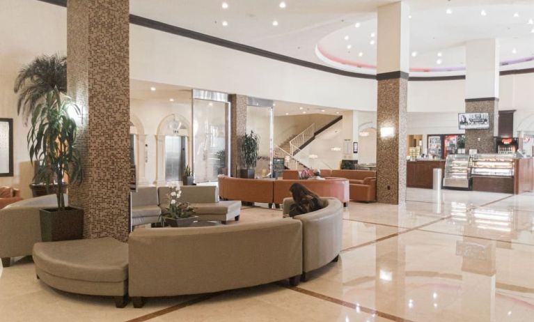 Lobby seating at Ramada Plaza Marco Polo Beach Resort.