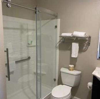 Guest bathroom with shower at North Bay Inn.