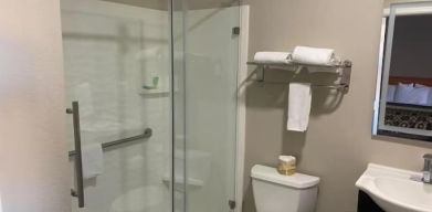 Guest bathroom with shower at North Bay Inn.