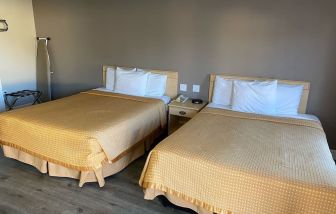 Two queen beds in this day room at North Bay Inn.