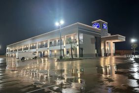 Hotel exterior and parking area at Palace Inn Blue Jones Rd. 