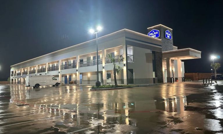 Hotel exterior and parking area at Palace Inn Blue Jones Rd. 