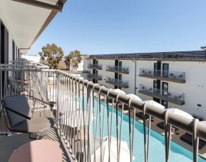 Day room with balcony at Lum Hotel Inglewood.