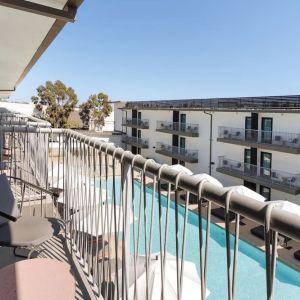 Day room with balcony at Lum Hotel Inglewood.