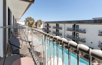 Day room with balcony at Lum Hotel Inglewood.