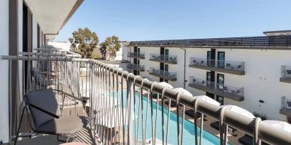 Day room with balcony at Lum Hotel Inglewood.