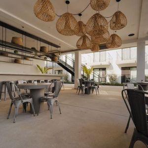 Lounge, bar, and dining area at Lum Hotel Inglewood.