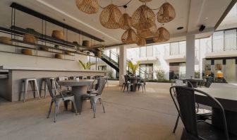 Lounge, bar, and dining area at Lum Hotel Inglewood.