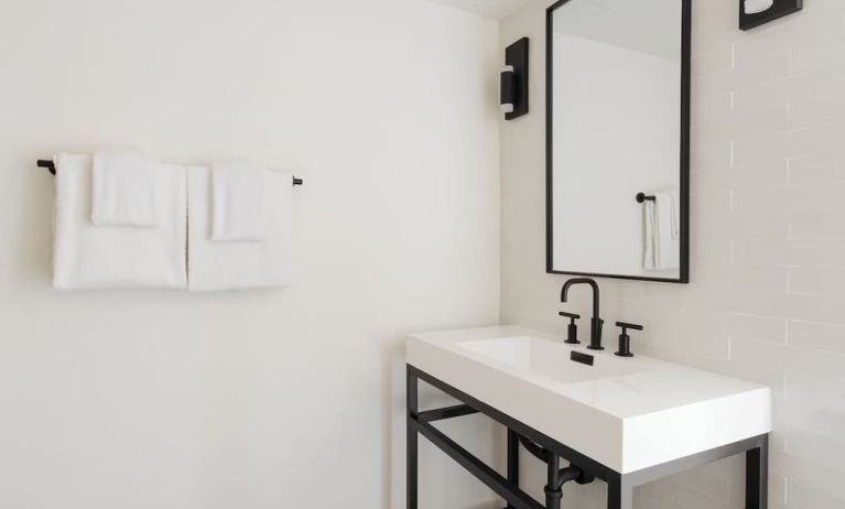 Guest bathroom with shower at Lum Hotel Inglewood.