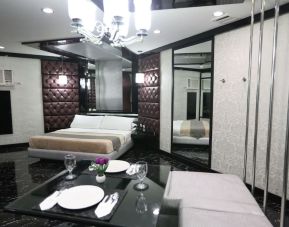 Spacious king room with dining area at Victoria Court North EDSA - Caloocan.