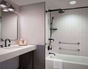 Guest bathroom with shower at Freepoint Hotel Cambridge, A Tapestry Collection. 