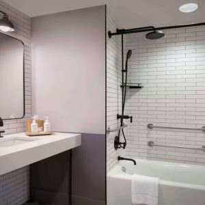 Guest bathroom with shower at Freepoint Hotel Cambridge, A Tapestry Collection. 