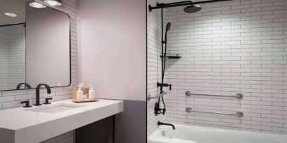 Guest bathroom with shower at Freepoint Hotel Cambridge, A Tapestry Collection. 