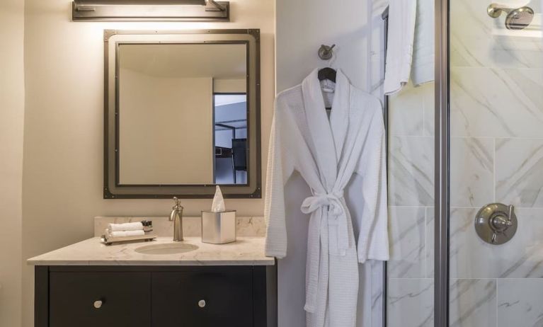 Guest bathroom with shower at The Boxer Boston.