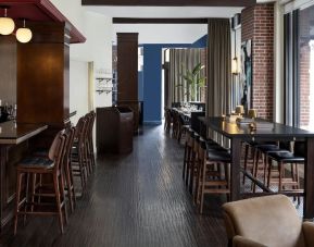 Dining area and bar at The Boxer Boston.