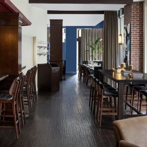 Dining area and bar at The Boxer Boston.