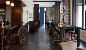 Dining area and bar at The Boxer Boston.