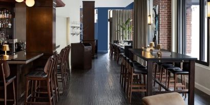 Dining area and bar at The Boxer Boston.