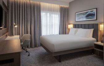 King bedroom with natural light at DoubleTree By Hilton London Angel Kings Cross.