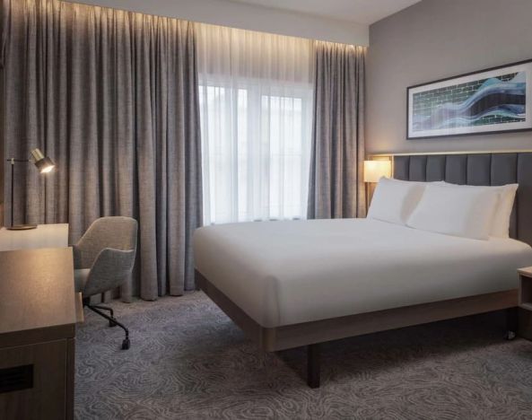 King bedroom with natural light at DoubleTree By Hilton London Angel Kings Cross.