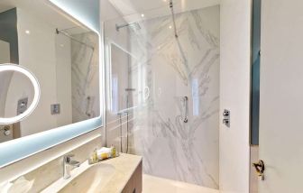 Guest bathroom with shower at DoubleTree By Hilton London Angel Kings Cross.