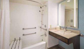 Guest bathroom with shower at Hilton Garden Inn IAH Houston.