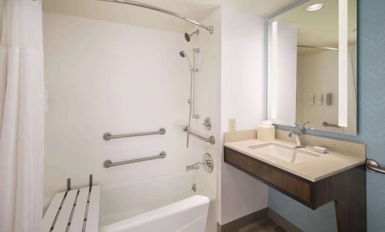 Guest bathroom with shower at Hilton Garden Inn IAH Houston.