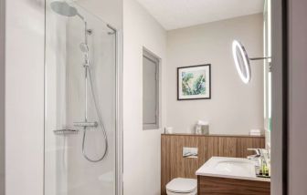 Guest bathroom with shower at DoubleTree By Hilton London - Chelsea.