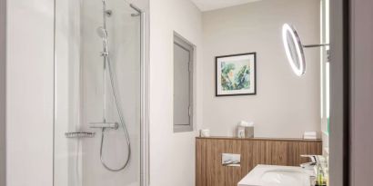 Guest bathroom with shower at DoubleTree By Hilton London - Chelsea.