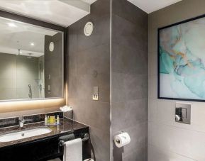 Guest bathroom with shower at Hilton Garden Inn London Heathrow Terminals 2 And 3.