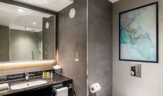 Guest bathroom with shower at Hilton Garden Inn London Heathrow Terminals 2 And 3.