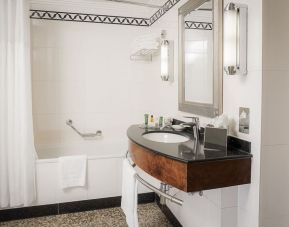 Guest bathroom with shower at Hilton London Paddington.