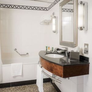 Guest bathroom with shower at Hilton London Paddington.