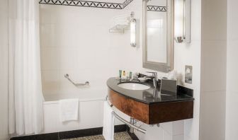 Guest bathroom with shower at Hilton London Paddington.