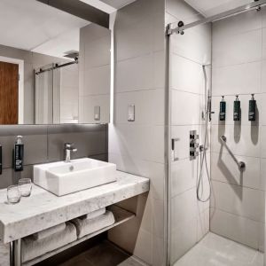 Guest bathroom with shower at DoubleTree By Hilton Lincoln.