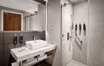 Guest bathroom with shower at DoubleTree By Hilton Lincoln.